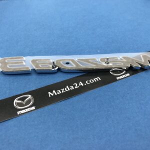 BHN951721 - 2014-2018 Mazda 3 hatchback trunk lid badge (model name)