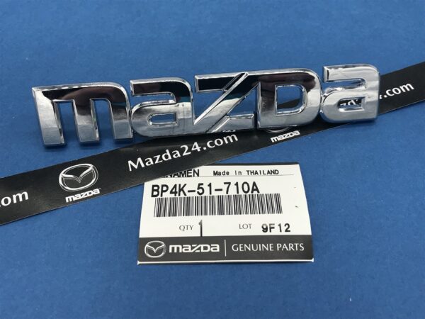 BP4K51710A - 2003-2009 Mazda 3 BK hatchback trunk lid badge (maker name)