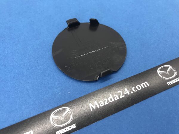 DK8A50A12ABB - Front bumper cover towing cap left Mazda CX-3